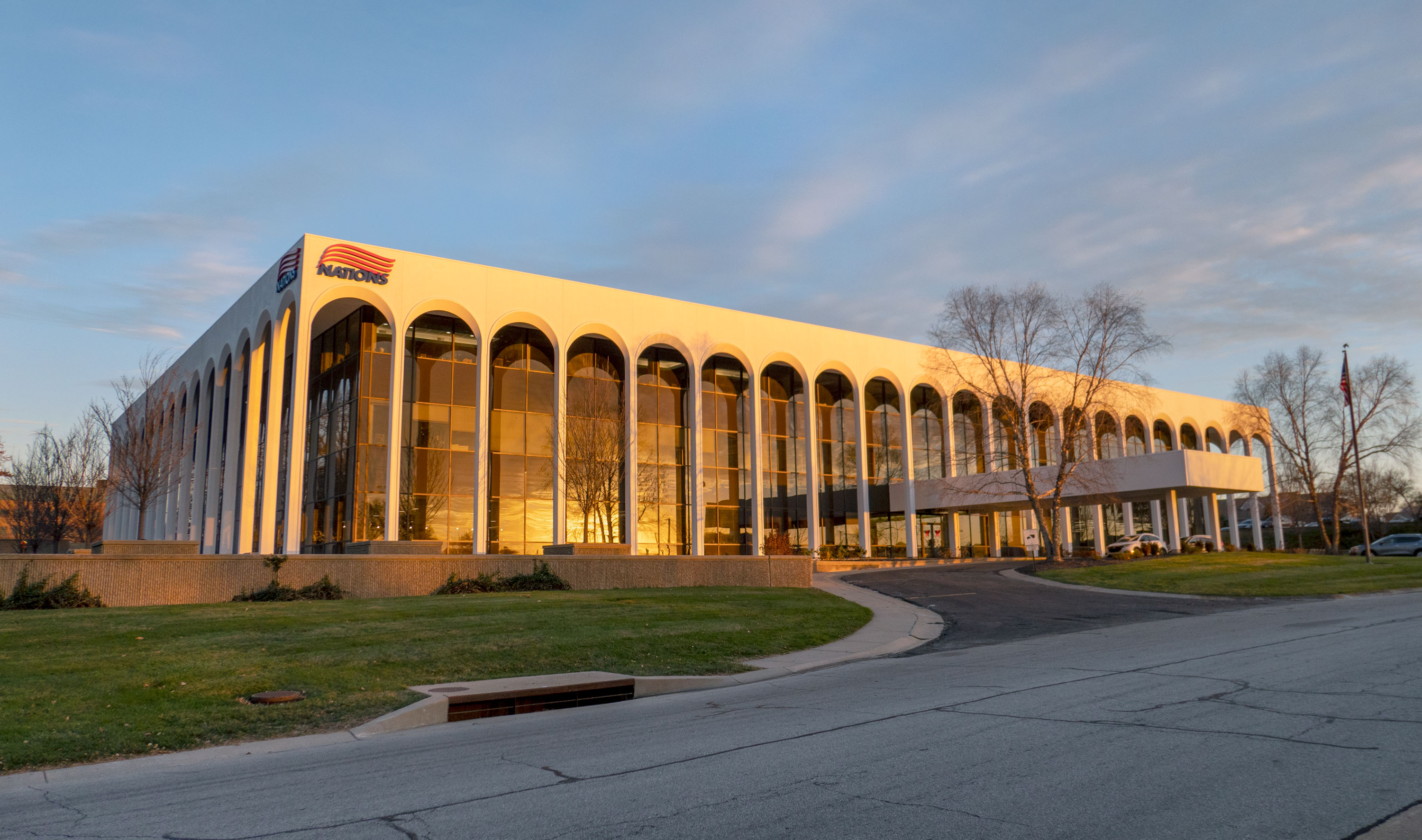 Nations Capital Services office building in Merriam, Kansas at sunset